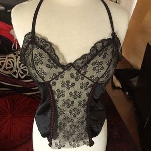 Vintage camisole with black lace and red ribbon.
